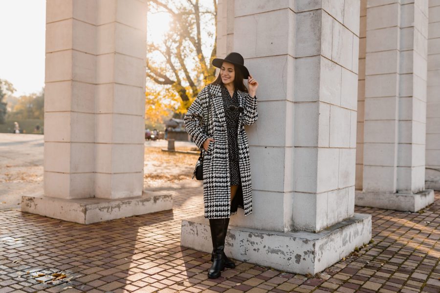 attractive-young-woman-walking-in-autumn-wearing-coat-scaled