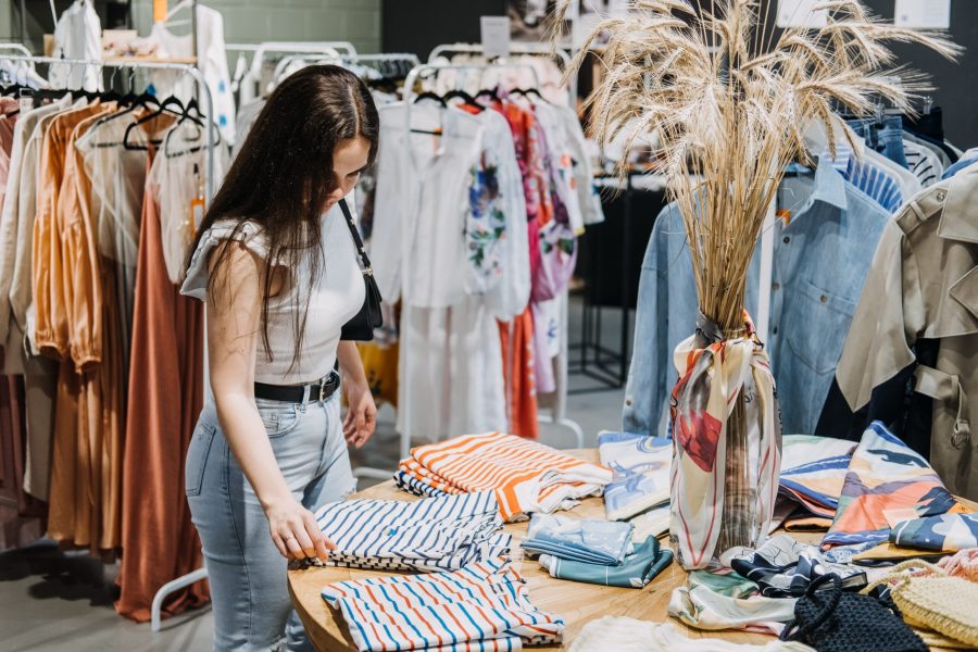 fast-fashion-woman-shopping-in-cloth-store-shopp-2022-08-24-23-13-55-utc-scaled
